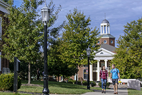 students walking across campus